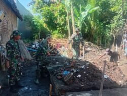 atgas TMMD Ke-127 Bangun Pondasi Rumah Ibu Haninah