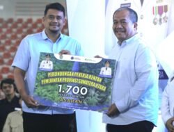 Bupati Asahan Terima 1.700 Kartu BPJS Ketenagakerjaan di May Day Sumut 2026