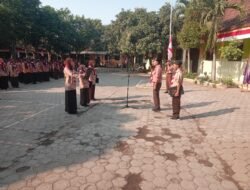 Peltu Zainal Makin Hadiri Apel Peringatan HUT Pramuka ke-65 Kecamatan Lekok
